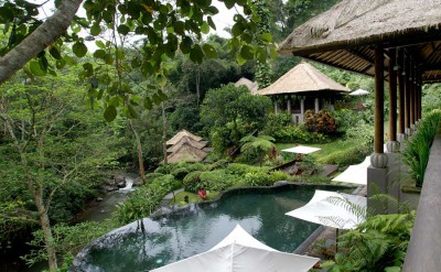 035 - spa area with freeform pool and thatched roof spa pavillions